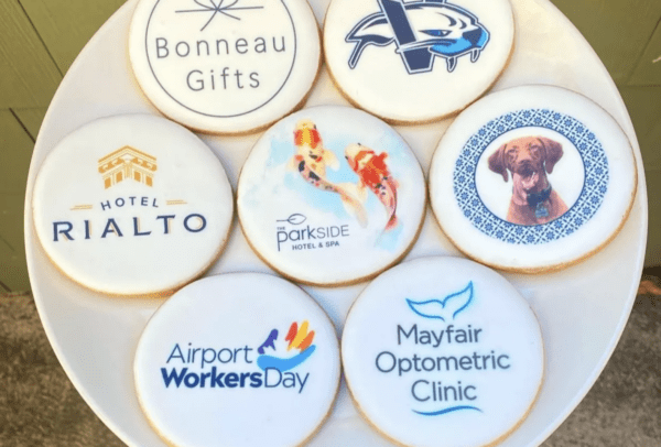 A plate of cookies with logos on them